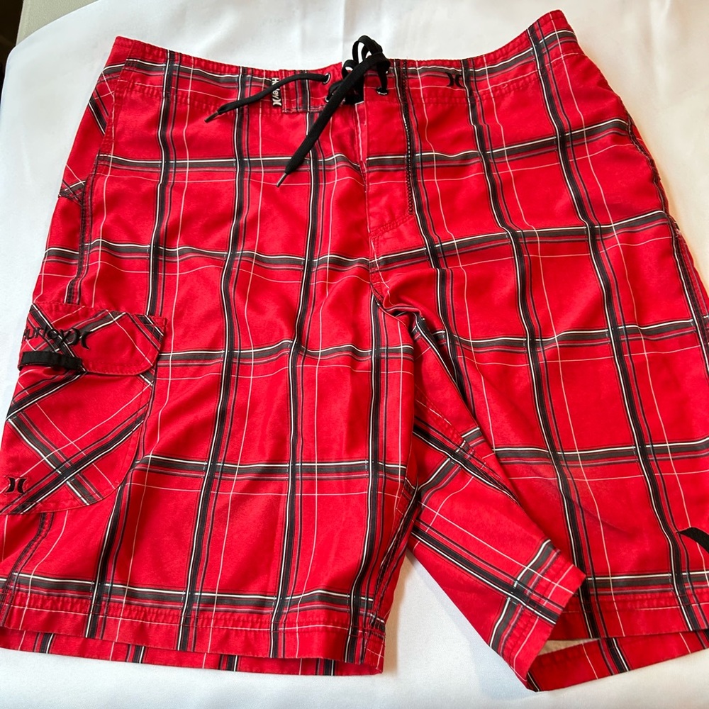 Hurley gently used board shorts in red, black and white in size 34